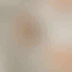 High-end cake smash portrait showing a baby girl enjoying her cupcake in a neutral studio near Orono, MN.