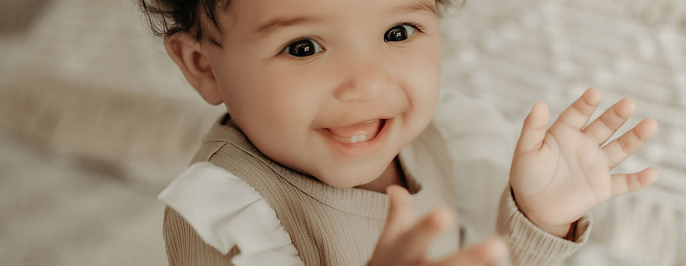Elegant milestone portrait of one-year-old girl with soft textures and neutral styling by Elsiebel Photography Minneapolis.