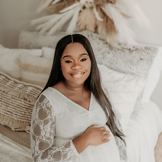 Soft and elegant maternity portrait of expecting mother in Lakeville MN studio, photographed by Elsiebel Photography.