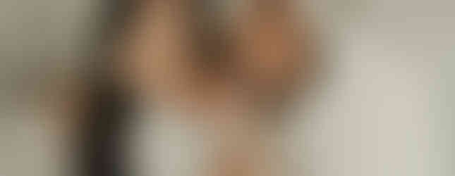 Mom and dad cuddling their newborn baby boy during a Maple Grove family newborn photography session