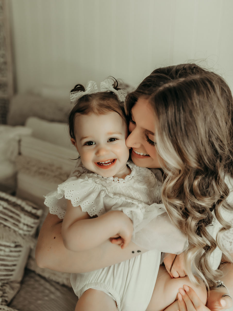Mother holding her baby girl during a luxury milestone photography session at Elsiebel Photography serving Burnsville, Minneapolis, Edina, Eden Prairie, Maple Grove, and surrounding areas