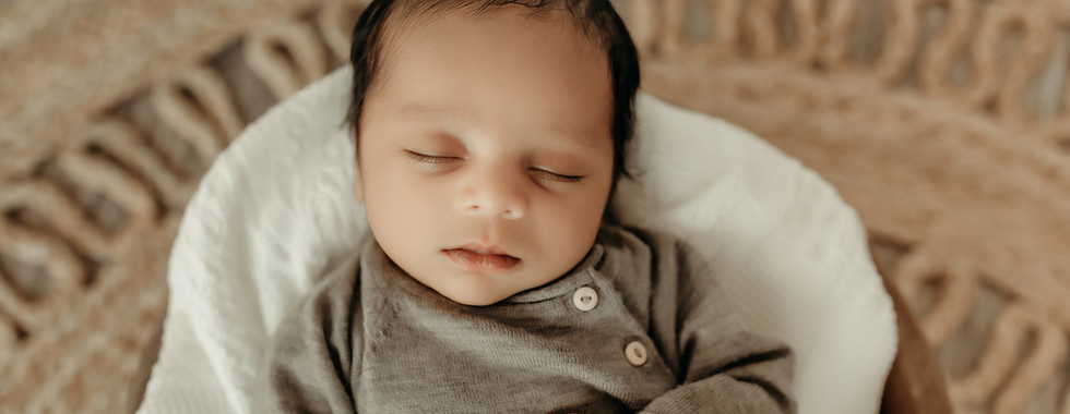 Peaceful newborn portrait with baby resting hands under chin, fine art newborn photography in Minneapolis by Elsiebel Photography.