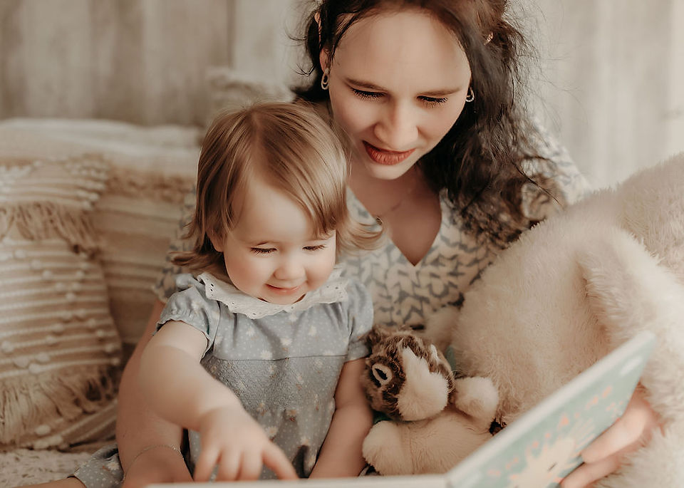Mother and daughter interacting naturally during a luxury first-year session by Elsiebel Photography, Medina Minnesota.