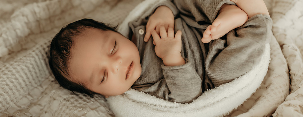 Luxury newborn boy wrapped in soft neutral fabrics during studio session at Elsiebel Photography, Minneapolis newborn photographer serving Edina and Twin Cities families.
