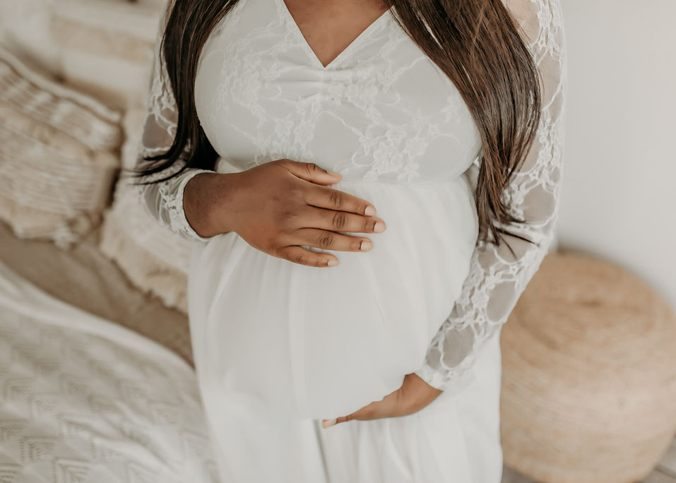 Artistic close-up of expecting mother’s hands on belly — fine-art maternity detail photo Burnsville MN.