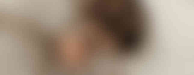 Mother cuddling her baby during a professional newborn session near Edina Minnesota