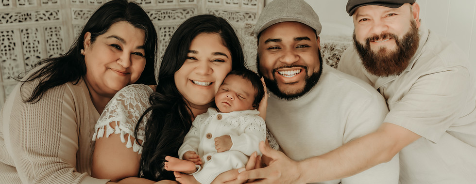 Family of four posing with newborn baby boy during a luxury newborn session near Minneapolis at Elsiebel Photography