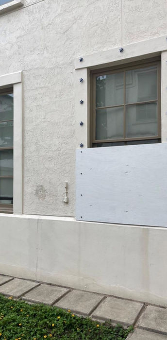 Reinforced window with a security panel on a white wall using The UUScrew®