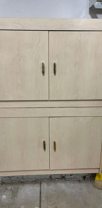 Wall-mounted light wood storage cabinet in a garage using The UUScrew®