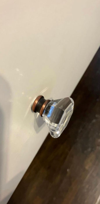 Crystal drawer knob on white cabinet door with The UUScrew®