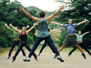 Group of people jumping in the air at the same time