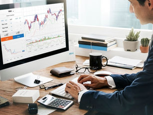 Brokerage professional analysing market risk and trading execution systems