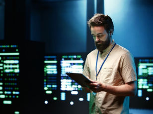 Software testing specialist reviewing QA processes in modern tech office