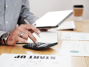 VAT professional discussing tax compliance and advisory work with a client.