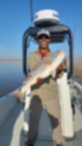 A men hold Louisiana Redfish