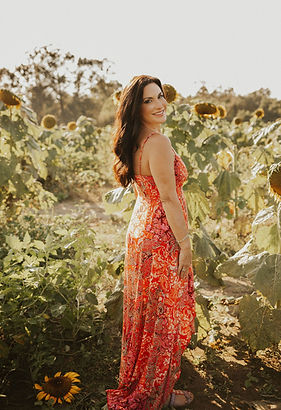 Lisastandingsmilingsunflowers_edited.jpg