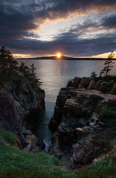 Golden light over the bay at Ravens Nest in Acadia National Park, Maine.