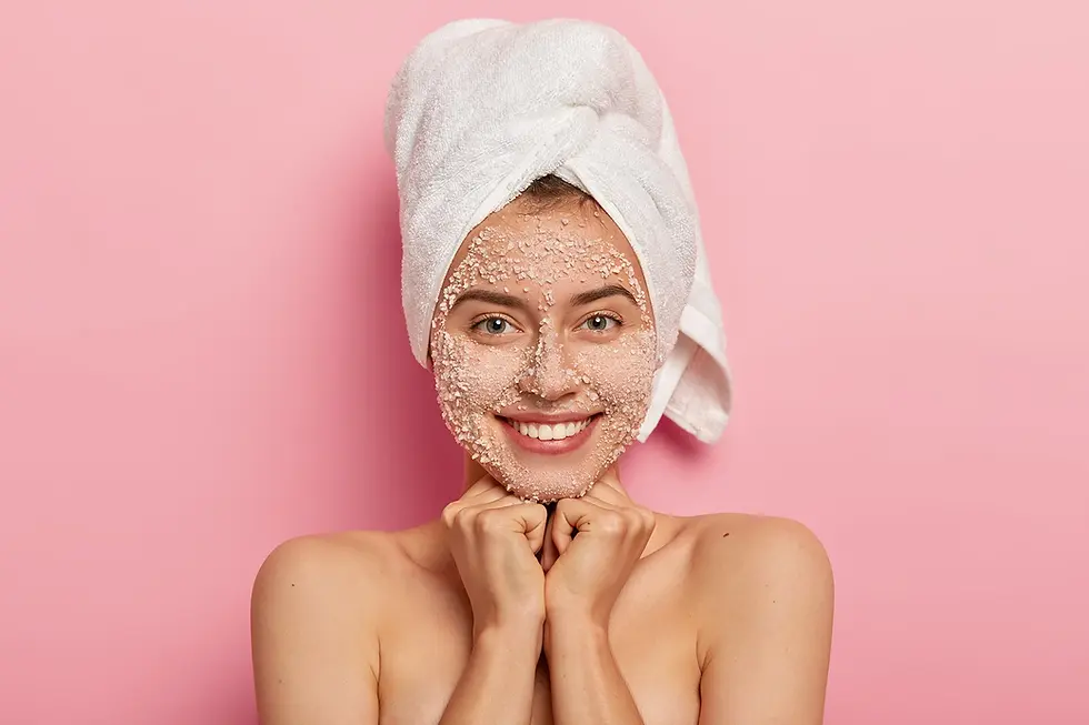 Woman with a salt facial treatment at Demeter's Garden medical spa in Asheville, NC.