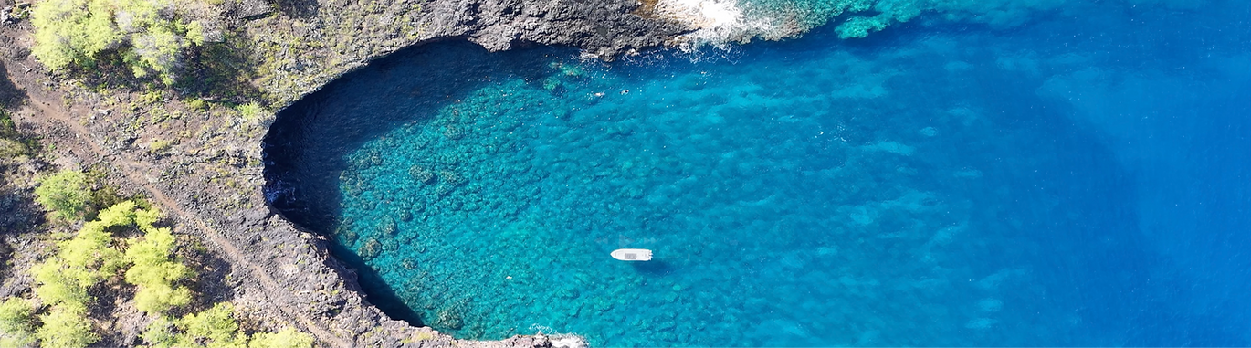 Kona snorkel tour boat exploring clear blue water off the Big Island with guests enjoying a guided ocean adventure.