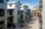 Modern Charleston residential development with contemporary townhomes, balconies, brick-paved street, and mixed-use building design details.