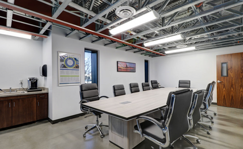 Modern conference room with large table and chairs
