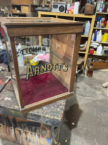 Arnott's Biscuits display cabinet 
Gold leaf text on glass panels done in house 