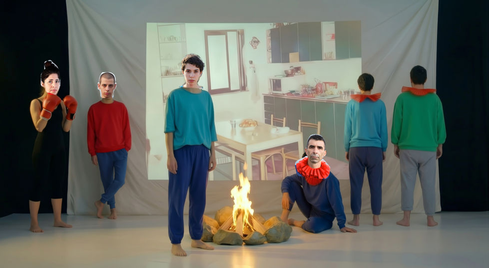 Still from the video: woman standing embracing hugging herself back.