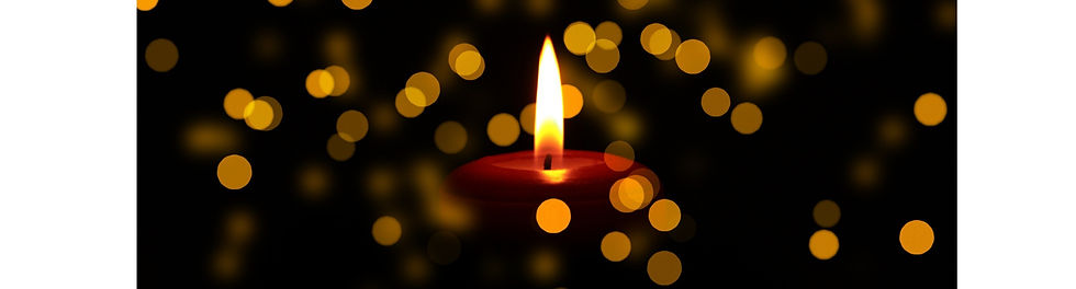 A Funeral Candle Surrounded by Gentle Floating Lights.