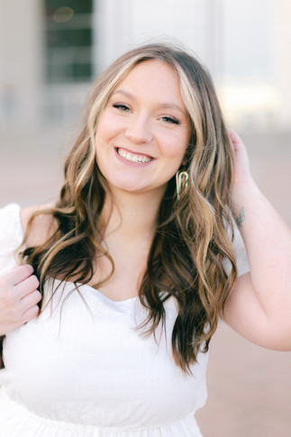 UNL girl graduate in a white dress