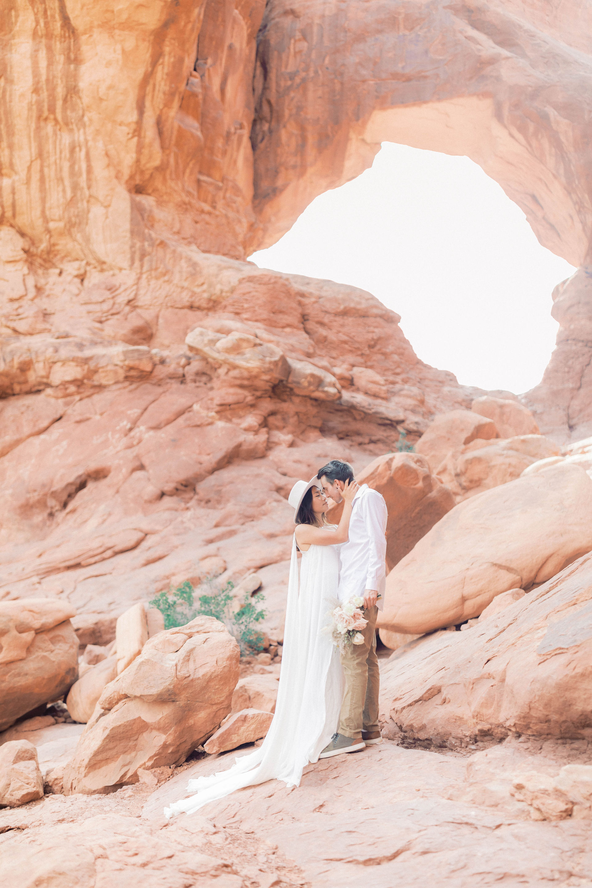 A couple getting married at double arches