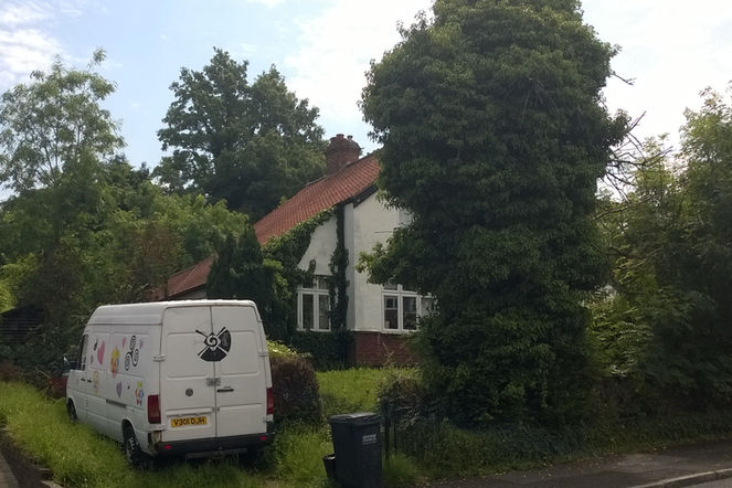Detached house with garden and caravan parked outside
