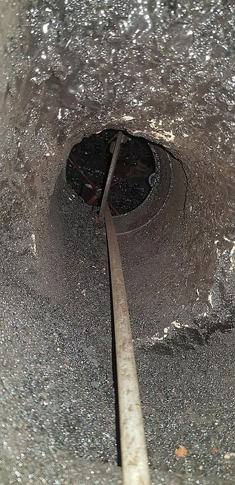 CCTV inspection camera being inserted into a chimney flue liner
