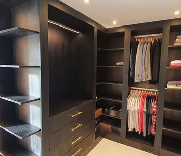 Walk in wardrobe with open shelving and hanging space