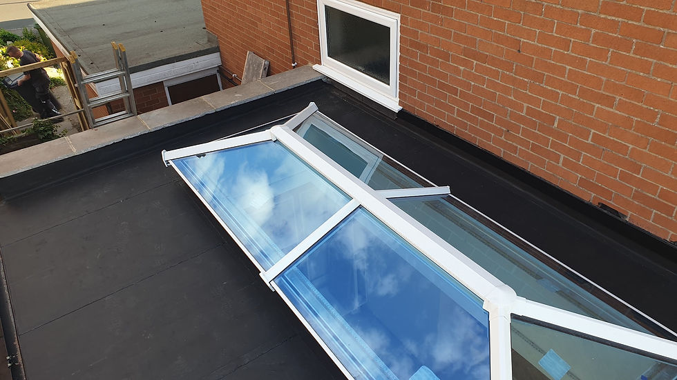 Velux roof window installed on a flat roof extension