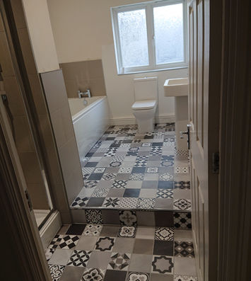 Contemporary bathroom with patterned floor tiles