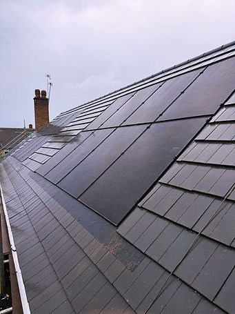 Solar panels installed on a modern slate roof in Stourbridg