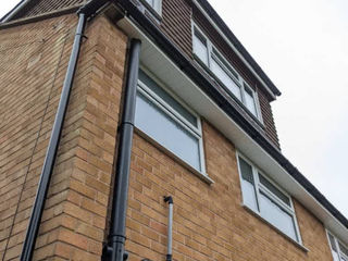 Low angle view of a brick house with a loft conversion