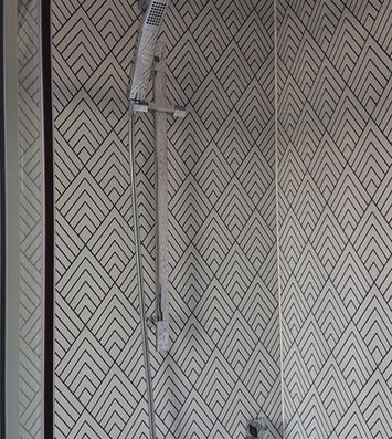 Walk in shower with patterned feature tiles