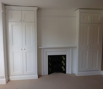 Traditional fitted wardrobes with integrated storage