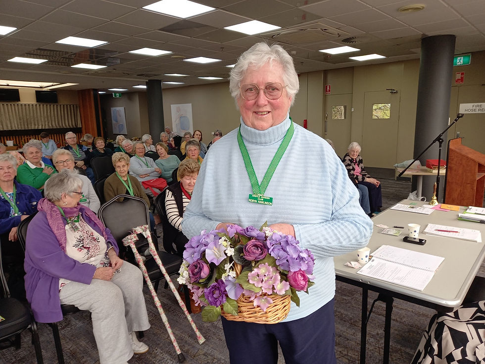 Arrangement in a basket artificial flowers winner Robyn Rawlinson