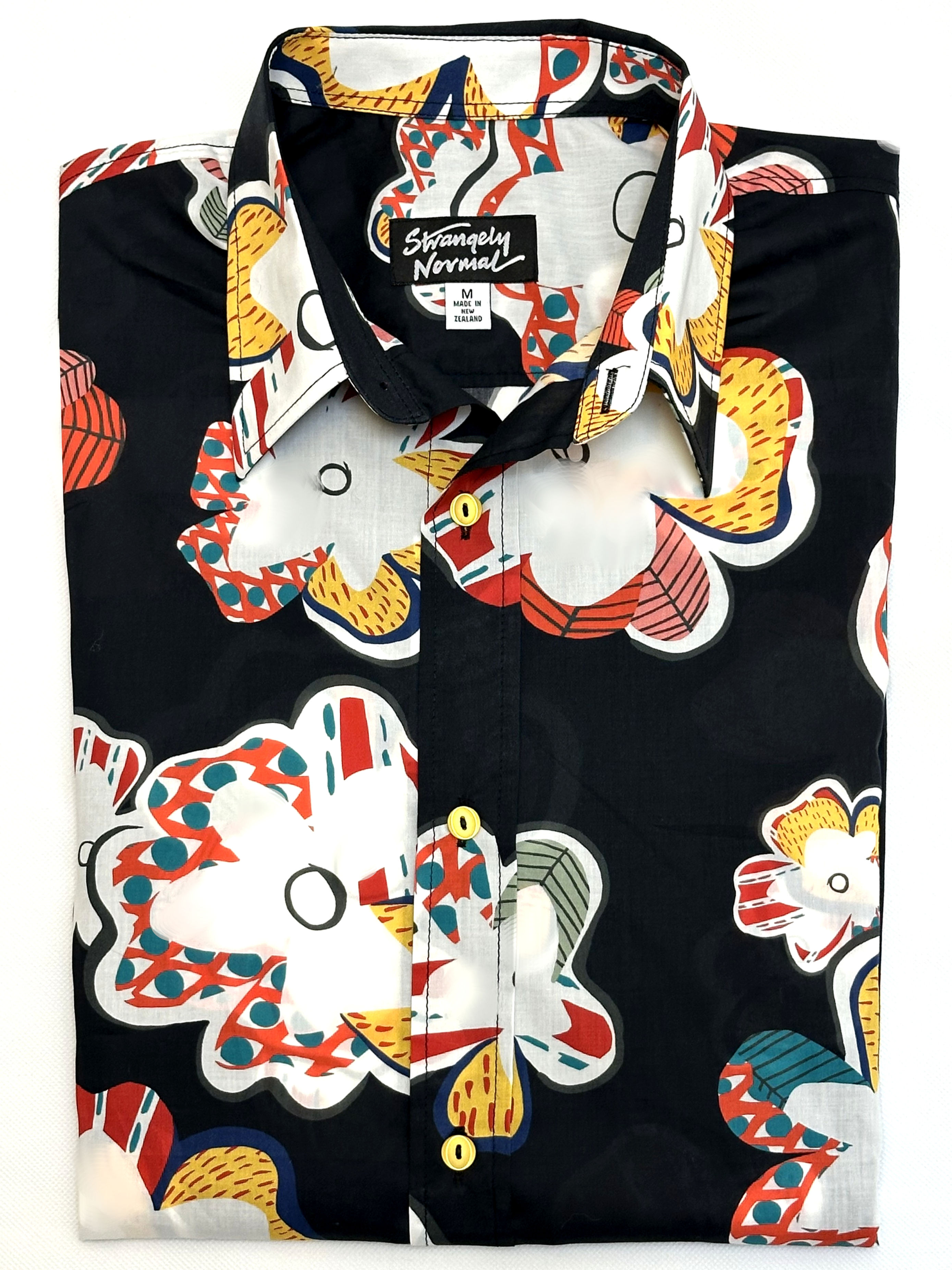 front of mans shirt with large arty flowers on black background