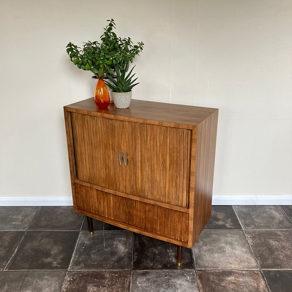 Thumbnail: A beautiful mid century teak drinks cabinet with tambour sliding doors on tapered legs with mirrored back