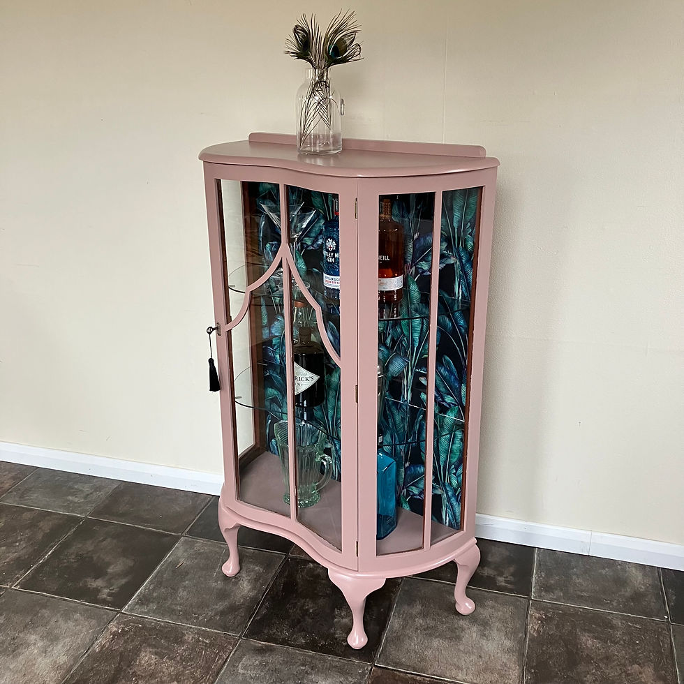 Thumbnail: Art Deco glazed gin display cabinet in Farrow and Ball Sulking Room Eggshell on cabriole legs with Tropical Paradise Velvet