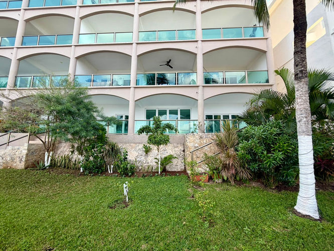 Balconies jut off El Cantil—empty, wide railings, ocean air sweeping in.