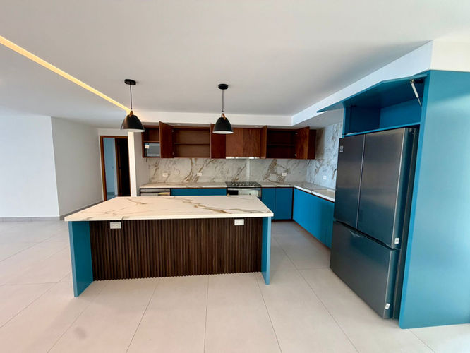 Open kitchen—El Cantil—fridge against the wall, plenty of counter space.