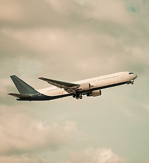 view-big-white-flying-plane-blue-sky-clouds-background_edited.jpg