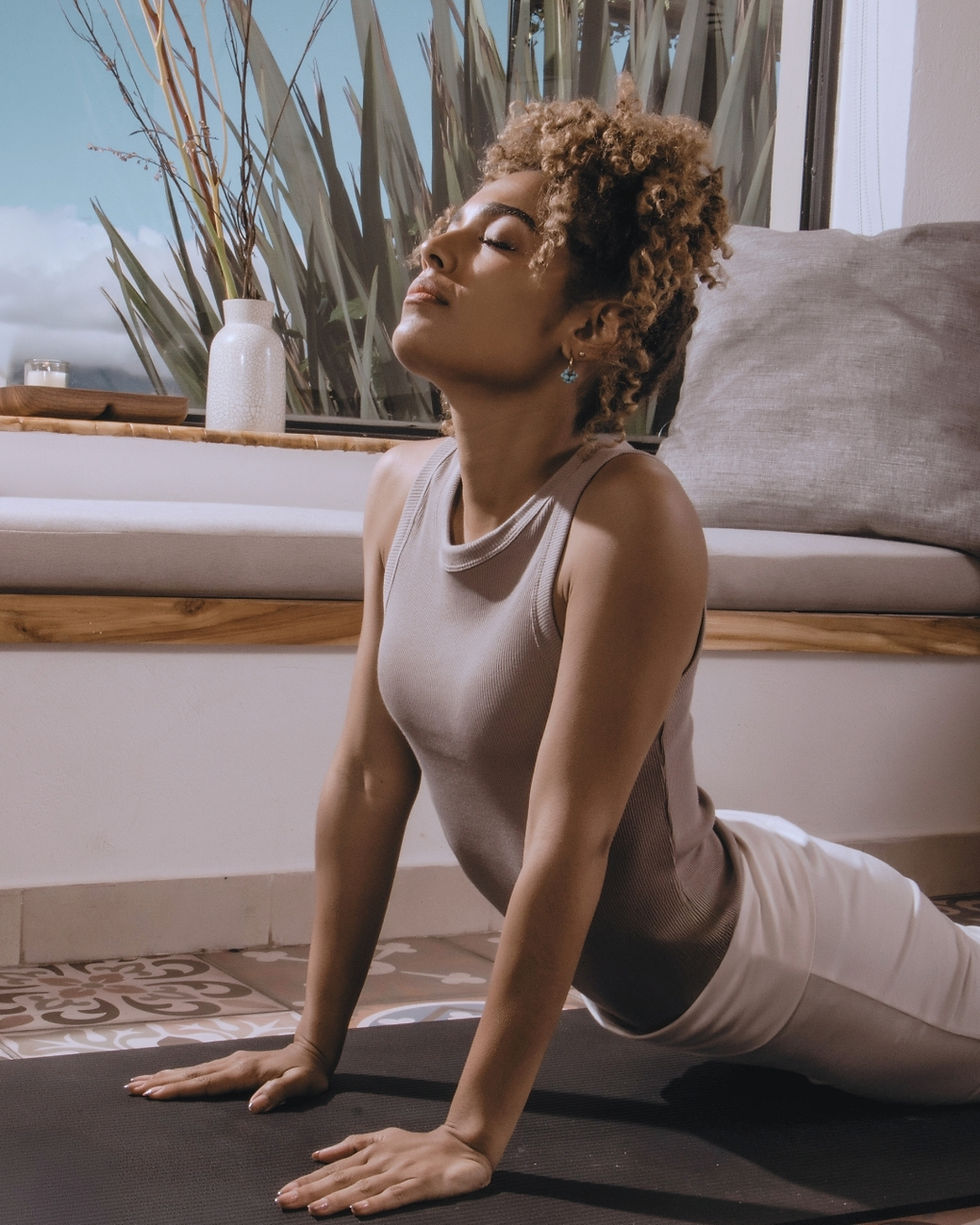 Woman in a backbend at the Barre, illustrating joint and connective tissue changes through menopause