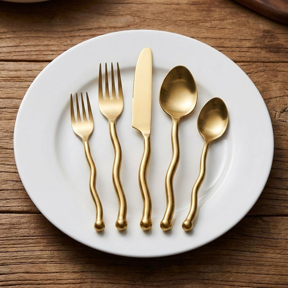 Gold curved handle table cutlery set with forks, knife, and spoons