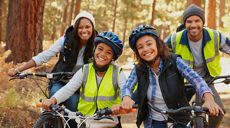Portrait Of Family Cycling Through Fall Woodland_edited_edited.jpg