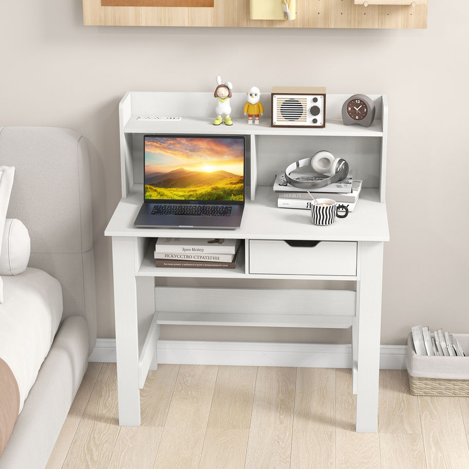 White desk with hutch, laptop, and books